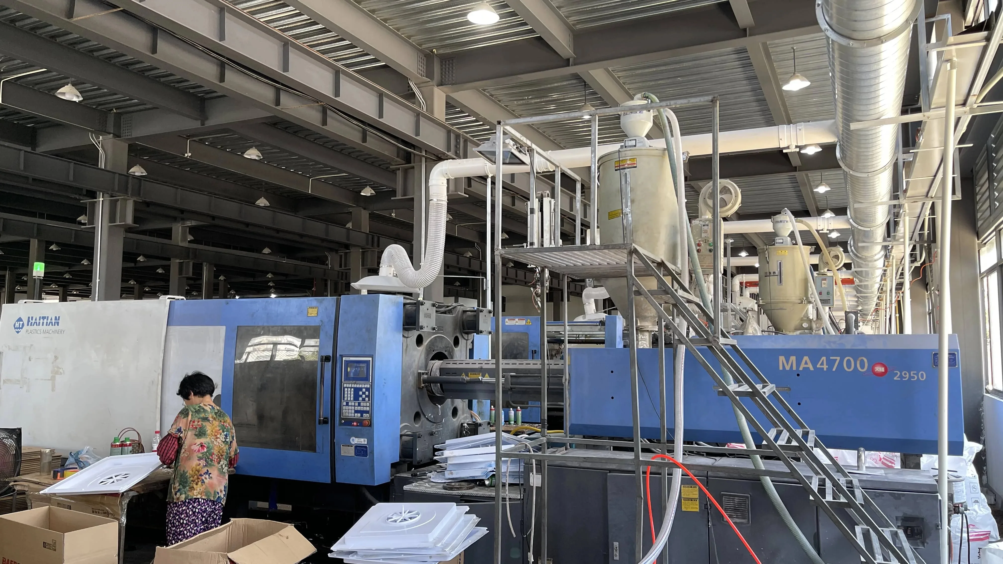 Injection molding line for ventilation fan parts